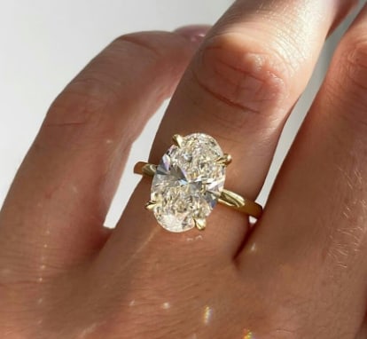 Certificted 5.00 Carat D VVS1 Oval Cut Lab Grown Diamond 14k Yellow Gold Solitaire Ring: Certificted 5.00 Carat D VVS1 Oval Cut Lab Grown Diamond 14k Yellow Gold Solitaire Ring|Side Stone Lab Grown Diamonds VVS1 D Color Round Cut 0.20 ct Ring Size US - 6.5