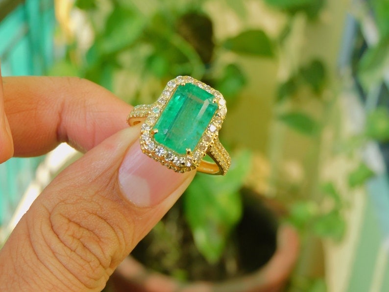 6.14 Carat Natural Emerald Certified Engagement Ring in 14K Solid Yellow Gold: Zambian Emerald 6.14 Carat Emerald Cut Natural Emerald Certified Engagement Ring in 14K Solid Yellow Gold - Side Stone Real Diamonds Vs1 - H Color Round Cut 0.45 ct Ring Size US - 6.5