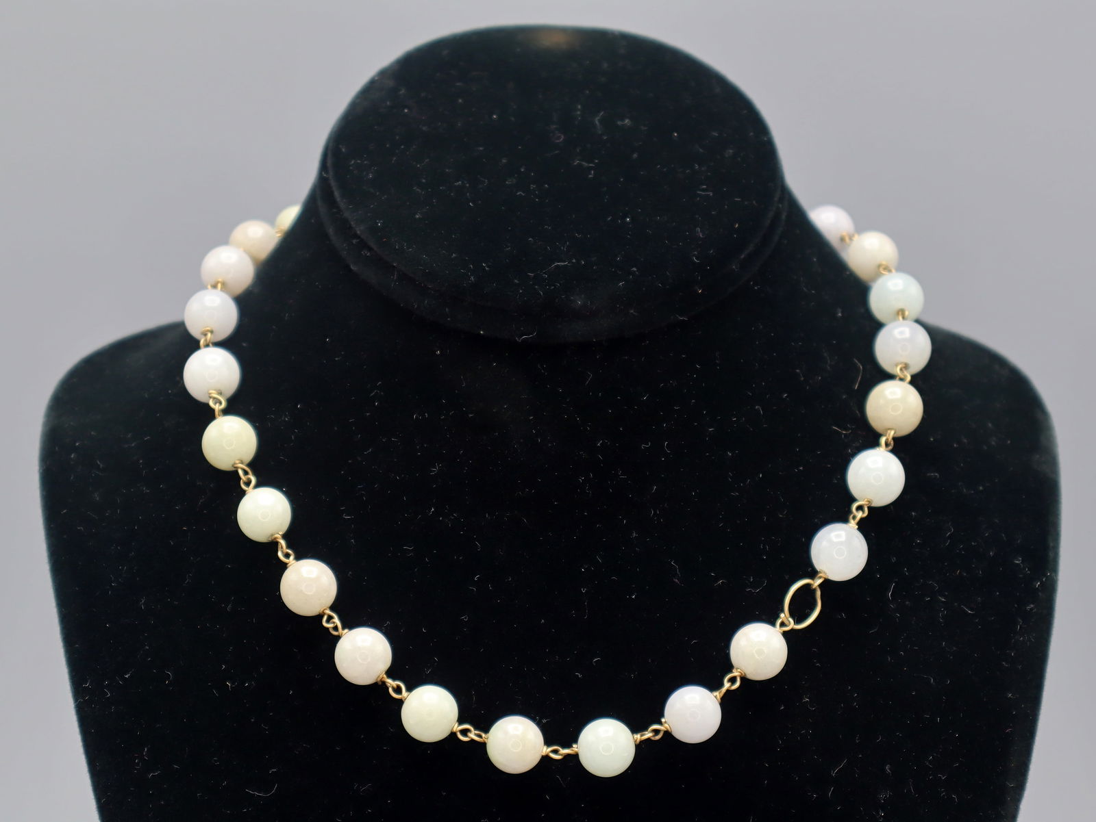Antique Pale Jadeite Ball Beads Necklace 14 Kt Gold Chain: Nice Pale Green To Purple Jade Beads, Antique Origins. In A 14 Kt Gold Links Or Chain. A Link On Chain Damaged And Repaired Temporarily With A Gold Wire. Dimensions Length 16” inches. Weight 46.