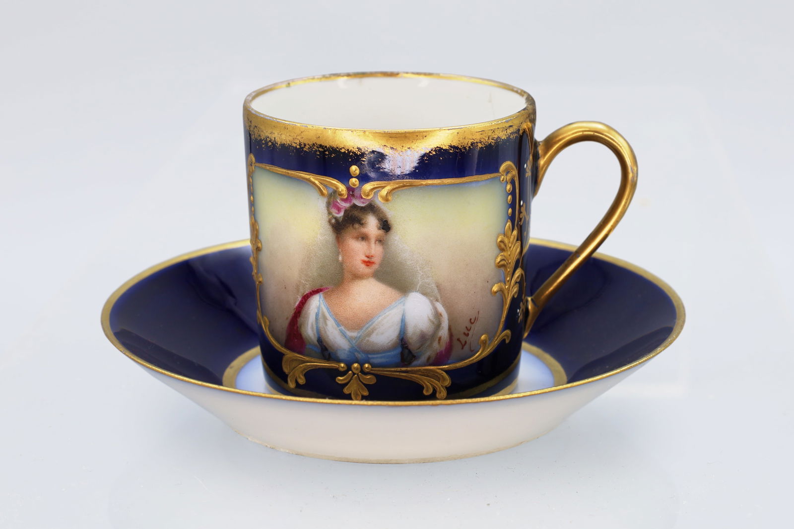 Sevres France, Antique 19th Century Porcelain Cup With Saucer, Hand Painted Miniature By Luc: Sevres France, Antique 19th Century Porcelain Cup With Saucer, Hand Painted Miniature By Luc. The Item Has Importer Marks From Argentina. Some Superficial Wear And Age. Condition As Expected For An It