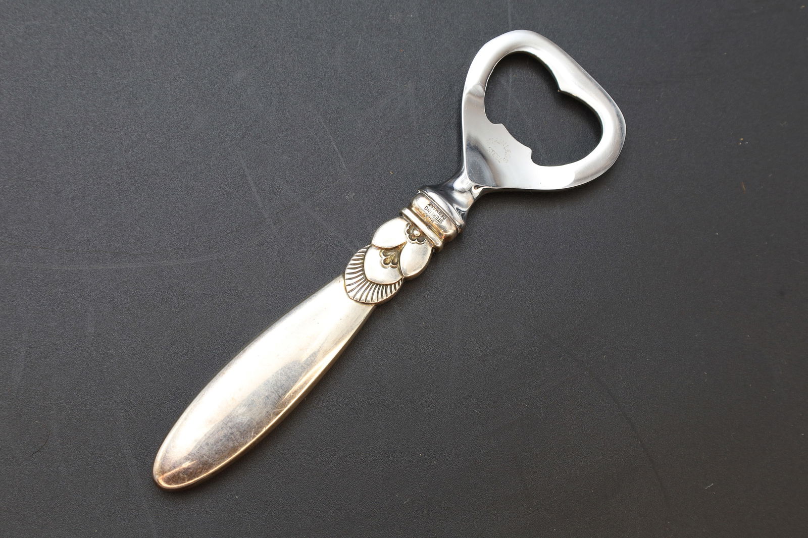 Georg Jensen, Denmark, Sterling Silver And Steel, Bottle Opener, Cactus Cutlery 1930s Hallmarks: Georg Jensen, Denmark, Sterling Silver Handle And Stainless Steel. Hallmarked. Model Named CACTUS, Serveware Cutlery From The 1930s. Vintage. Refer to photos and description. DISCLAIMER: Read The Desc