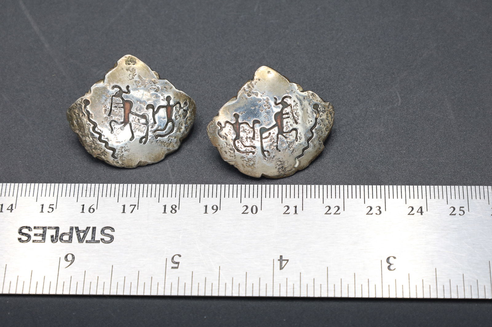 Rare Southwestern A+M Coass 1996 Stud Earrings With Etched Tribal Motifs, Sterling And Copper: Rare Southwestern Americana Jewelry With A Kokopelli And A Kachina Dancing. Signed By A+M Coass 1996 Stud Earrings With Etched Tribal Motifs, Sterling And CopperDimensions, 28 x 32 mm, Weight 12.55 gr