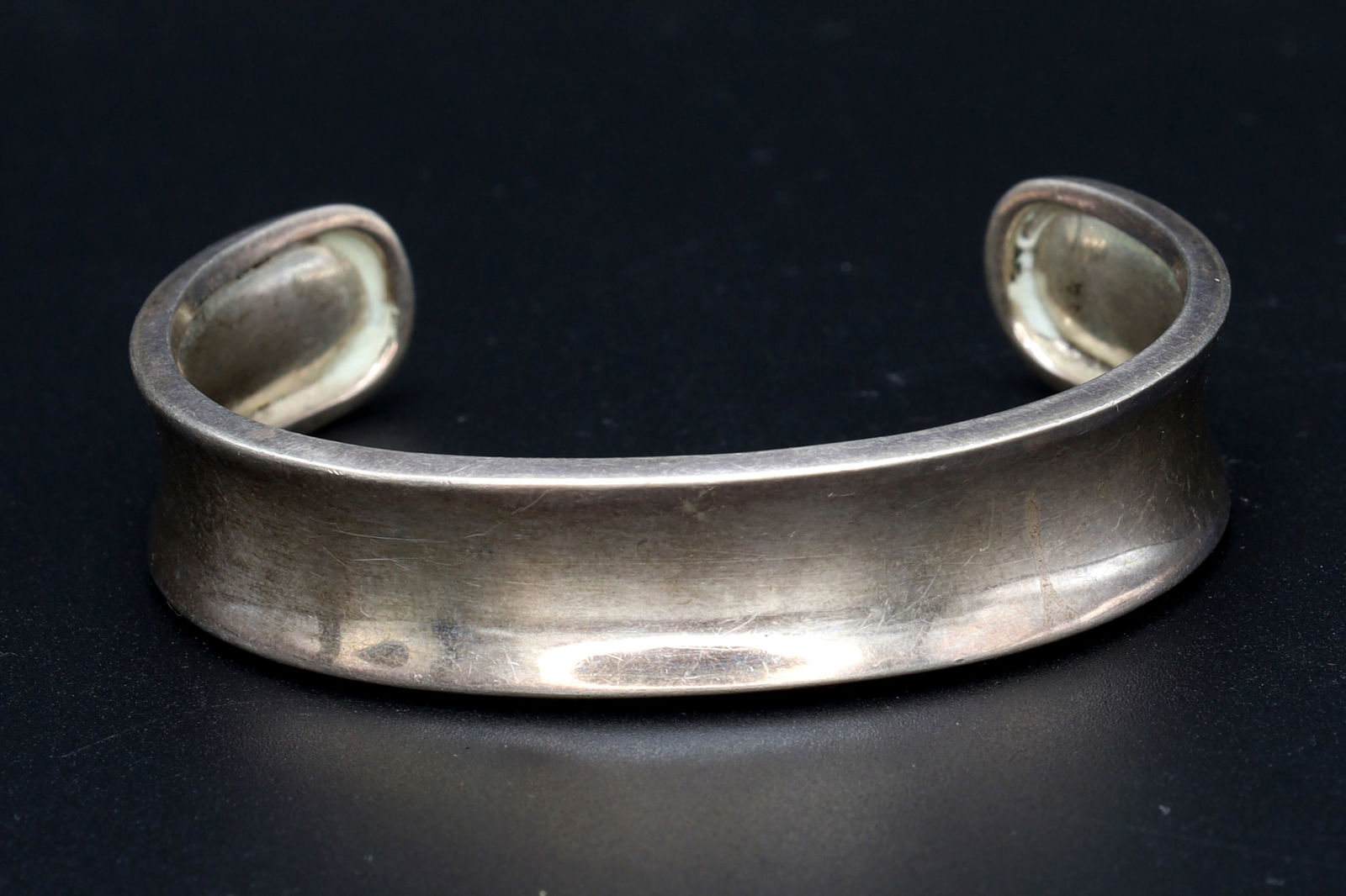 Mexico, Wavy Cuff Bracelet In A Modernist Style, 925 Sterling Silver Tested, Vintage 1980s Fashion: Dimensions Inner 2.25 x 1.75 inches, Widest Point 0.55 inches, Weight 19 grams. All measurements are approximate. Patina, Dings, General Wear And Aging. Sold As Pictured. Mexico, Wavy Cuff Bracelet In