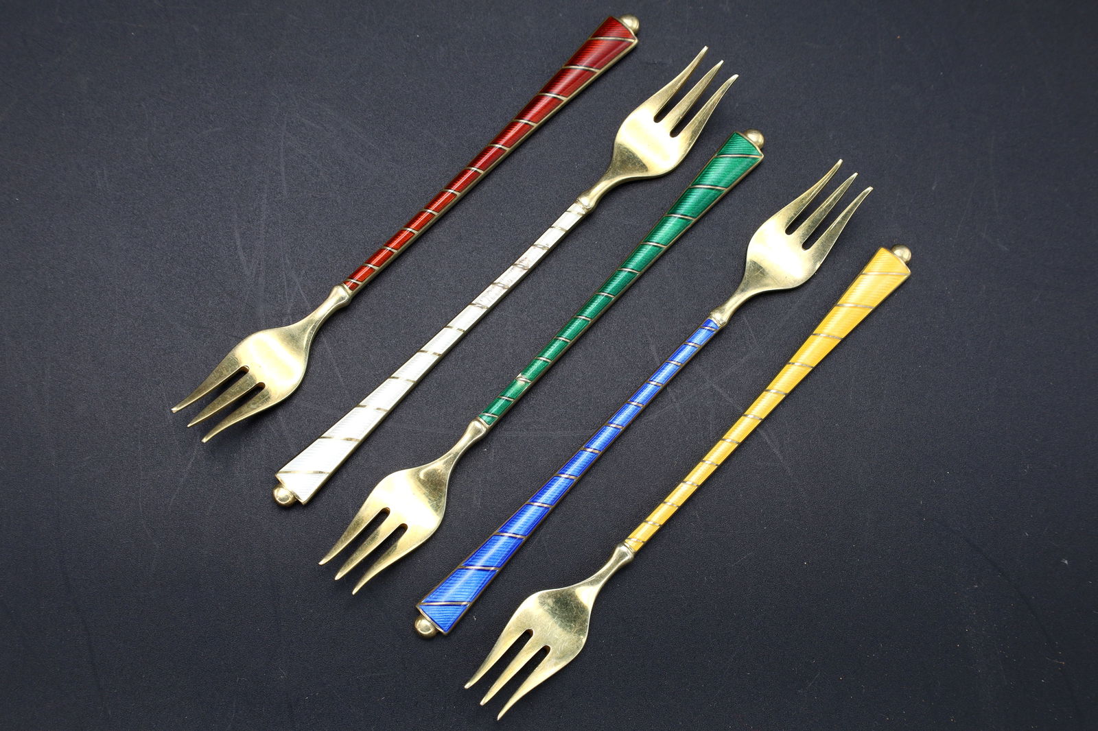 ELA Denmark Guilloche Sterling Cocktail Forks, Group Of 5 Units, Scandinavian, Mid Century Cutlery: Dimensions, Length 4.75 inches. Total Weight 69.23 grams. All measurements are approximate. ELA Denmark Guilloche And Sterling Cocktail Forks, Group Of 5 Units, Scandinavian, Mid Century Cutlery, Dani