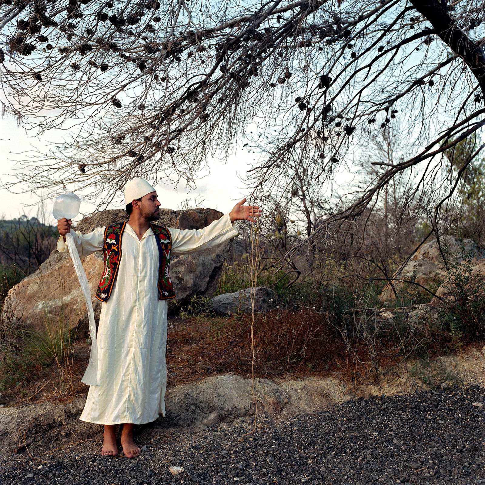 Ein Hod, Israel, Hasselblad Analogue Photography Print 24 x 24 inches, Cuban Artist Conrado Maleta: Title: Shepherding Clouds And Souls, Burnt Forest At The Holy Mount Mar Eilas, Har HaKarmel Israel, 2011. Color Medium Format Analogue Photography, Man Male Portraiture. Middle East Visual Poetry. Con