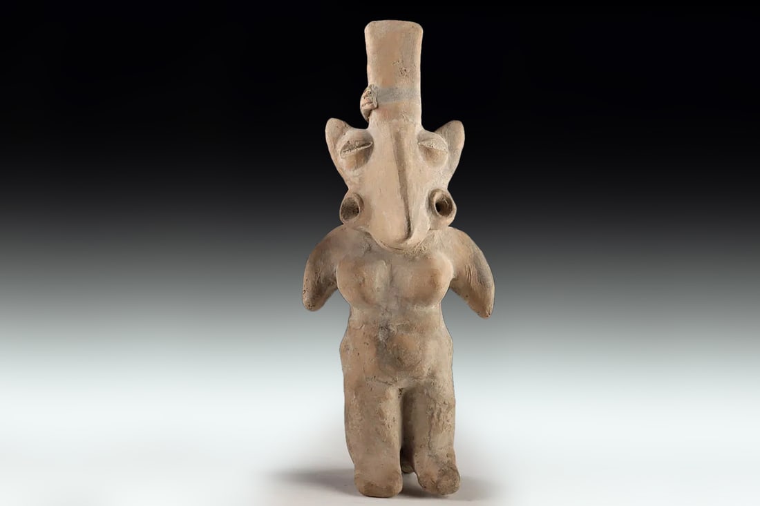 Ancient Pre Columbian Jalisco Pottery Female Standing Figure With Long Head, Ca 300 BCE to 300 AD: Pre-Columbian Civilizations Of West Mexico, Jalisco, Circa. 300 BCE To 300 AD. A Jalisco Pottery Standing Nude Female Figure Presents A Striking Study In Its Form, Representational Symbolism, And Regi