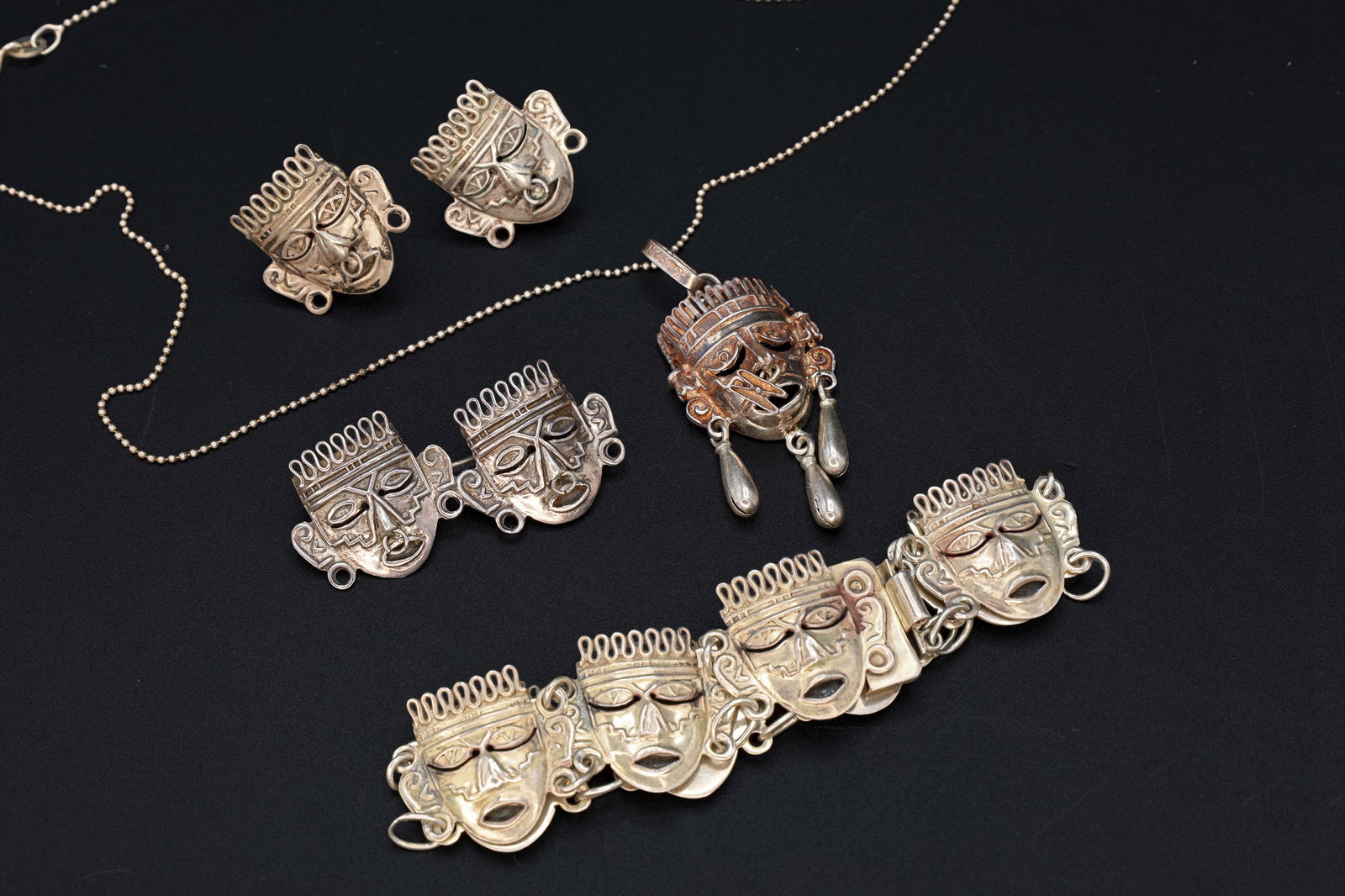 Taxco Mexico Jewelry Set, Art Deco Pendant Necklace, Brooch, Bracelet, Earrings, Warrior Aztec Mask: Dimensions, Chain Length 16 inches, Pendant 1.25 x 0.85 inches, Bracelet Length 7 inches, Brooch 0.75 x 0.75 inches, Earrings 0.8 x 1.0 inches. All measurements are approximate. Patina, Dings, General