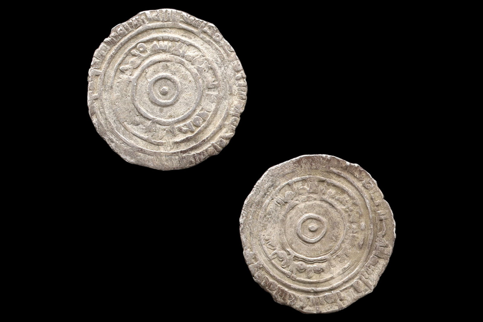 Medieval Egypt, Fatimids, al-Aziz Billeh, Fractional Value Of Half Dirham, Islamic Silver Coin Dinar: Dimensions, Diameter 18mm. Weight 1.4 grams. All measurements are approximate. Sold as pictured. // Medieval Egypt, Fatimids, al-Aziz Billeh, Fractional Face Value Of Half Dirham, Silver Coin With Ara