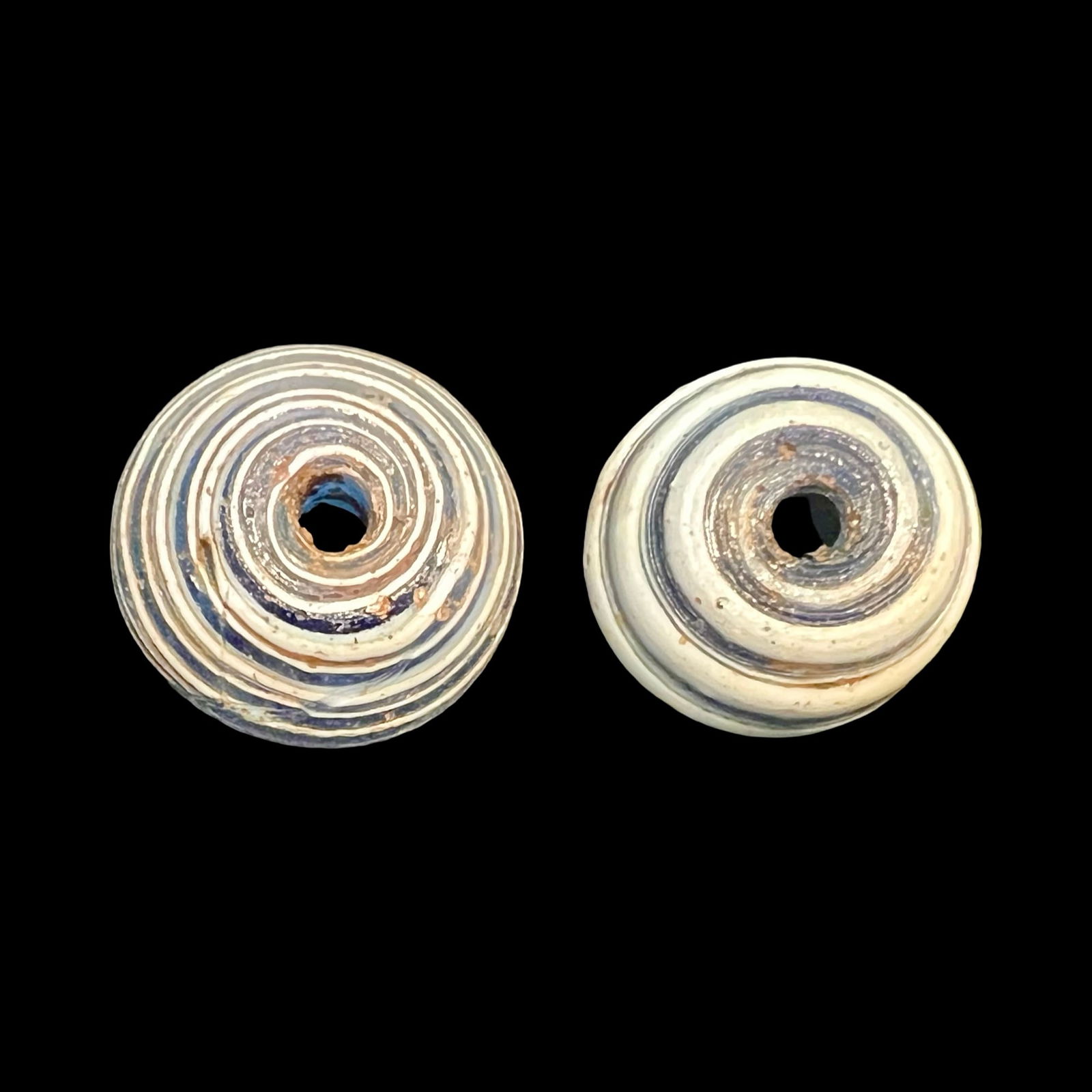 A pair of Roman glass spindle whorls (1 of 3)
