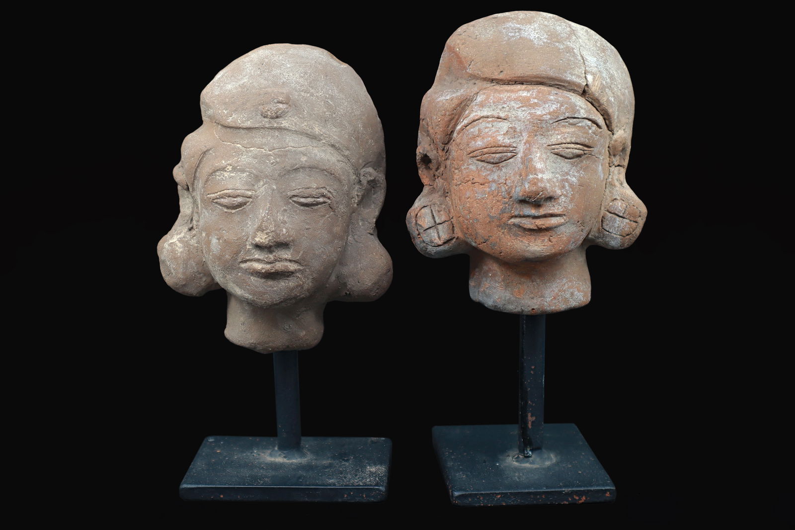 Majapahit Terracotta Heads, A Pair Of Female Sculptures On Metal Stands, East Java, Indonesia, Asia: Dimensions, Average Height 4.35 inches. All measurements are approximate. Sold as pictured. Majapahit Terracotta Heads, A Pair Of Female Sculptures On Metal Stands, East Java, Indonesia, Ethnic Southe