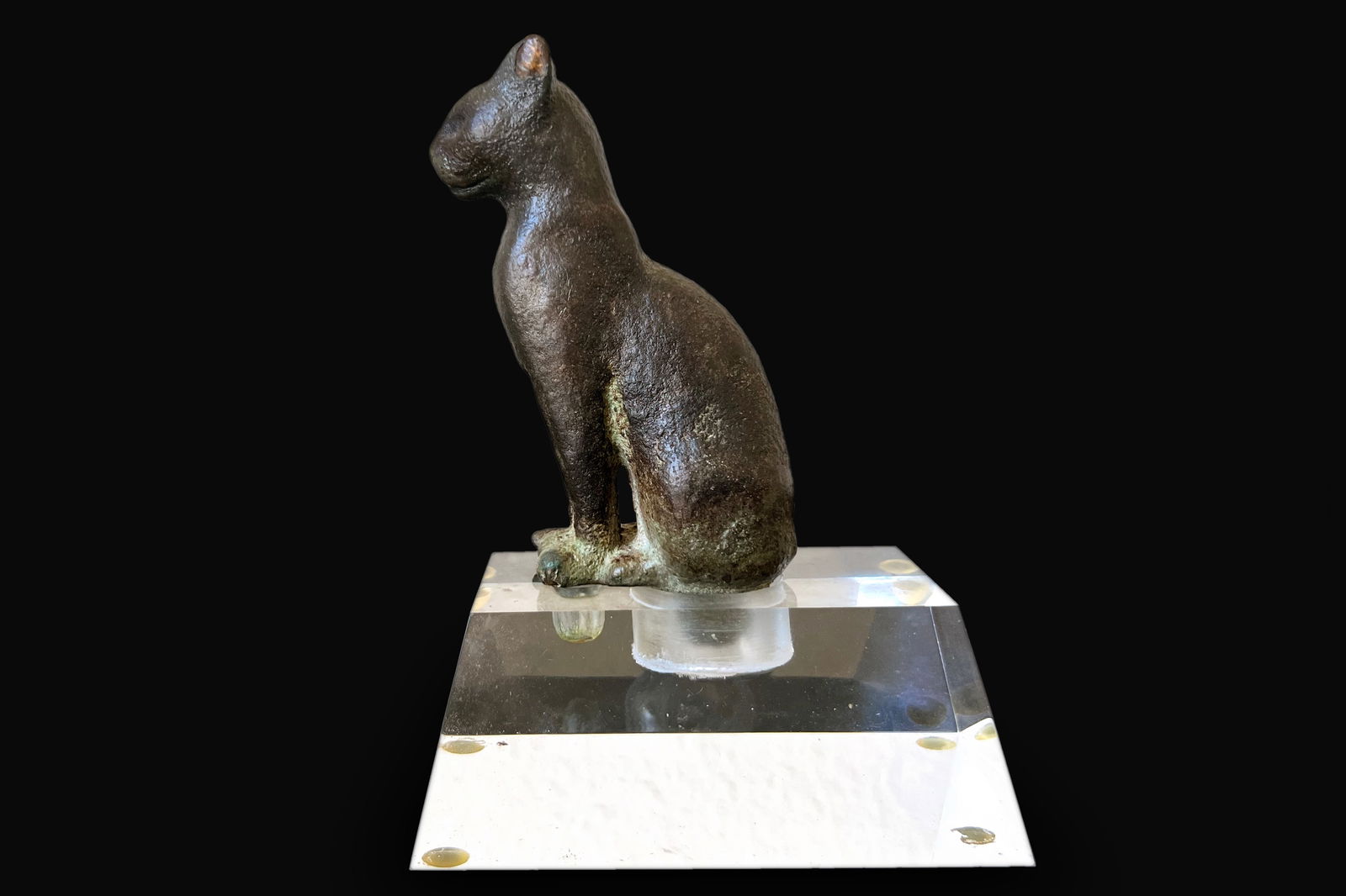 Egyptian Late Dynastic Bronze Figure of Cat, 5 Inches Tall. Antiquities And Collectibles, Sculpture: Ancient Egypt, Late Dynastic to Ptolemaic Period, circa 664 to 30 BCE. An exquisite cast-bronze figure of a cat of an instantly recognizable Egyptian style, seated upon its plump haunches with its