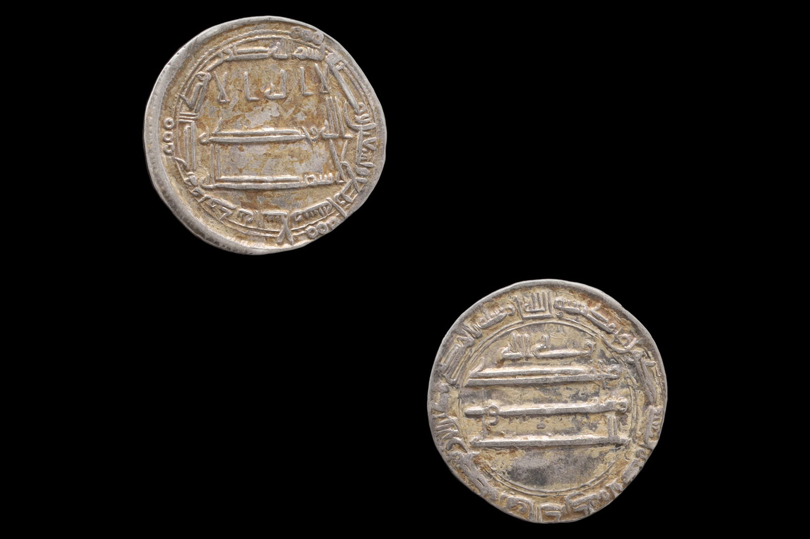 Medieval Islamic Silver Coin, Abbasid Caliphate Madinat Al Salam, Late Al Rashid Dirham, Middle East: Dimensions, Diameter 21mm, Weight 2.95 grams. All measurements are approximate. Patina, Surface Wear And Aging. Sold As Pictured. A Very Fine Islamic Empire, Abbasid Caliphate Silver Dirham Coin Under