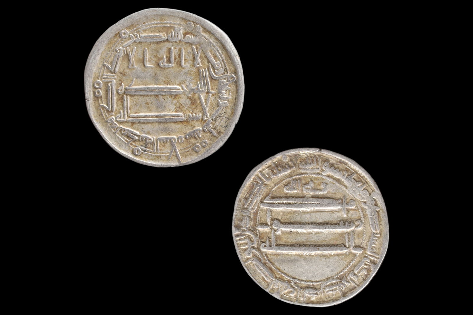 Medieval Islamic Silver Coin, Abbasid Caliphate Madinat Al Salam, Late Al Rashid Dirham, Middle East: Dimensions, Diameter 21mm, Weight 2.95 grams. All measurements are approximate. Patina, Surface Wear And Aging. Sold As Pictured. A Very Fine Islamic Empire, Abbasid Caliphate Silver Dirham Coin Under