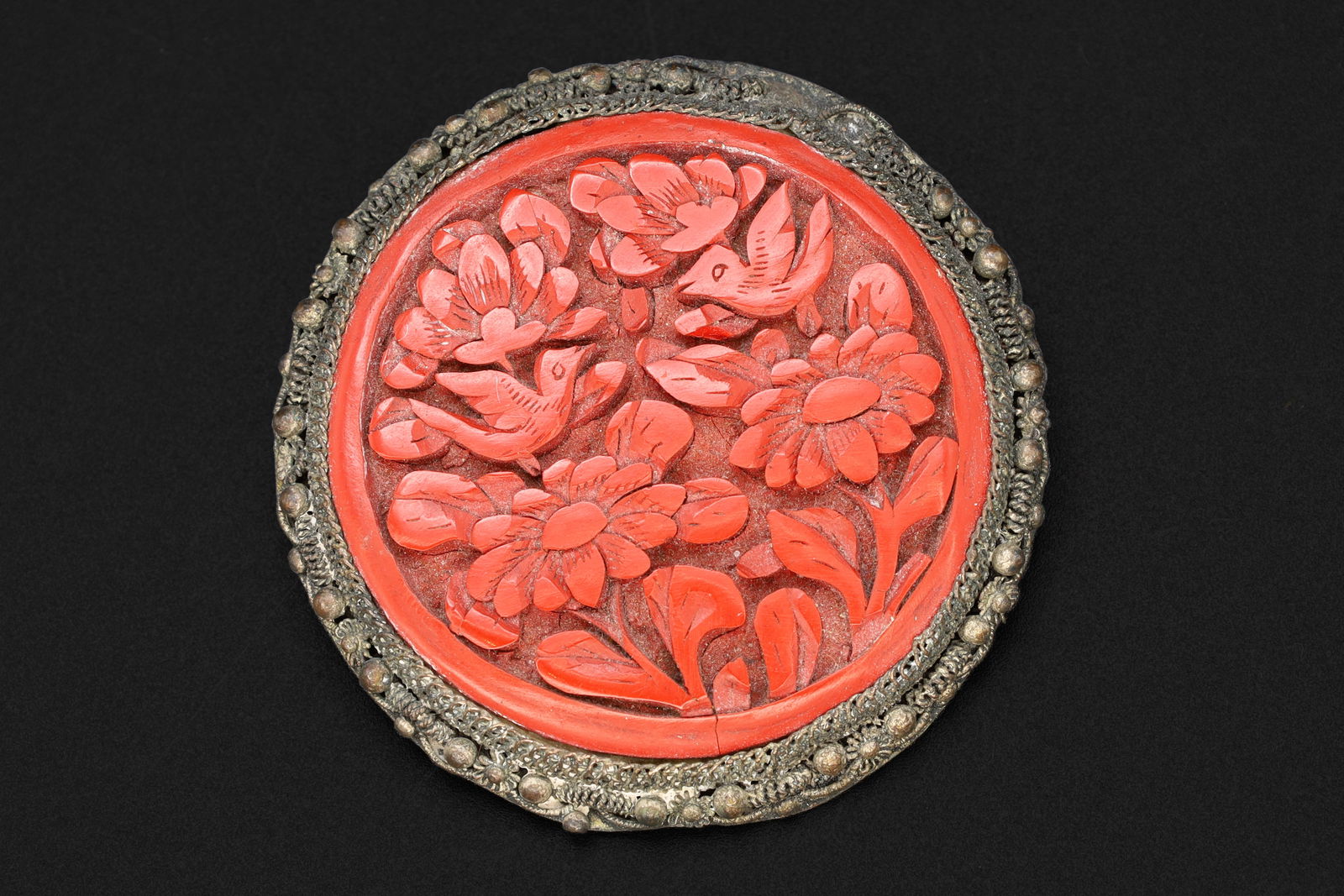 Antique 1920s Art Deco Brooch, A Carved Red Cinnabar And Silver Plated Brass, Chinese Republic Era: Dimensions, Diameter 2 inches, All measurements are approximate. Patina, Lost of plated finish, Surface wear and aging. Sold as pictured. Antique 1920s Art Deco Brooch, A Carved Red Faux Cinnabar And
