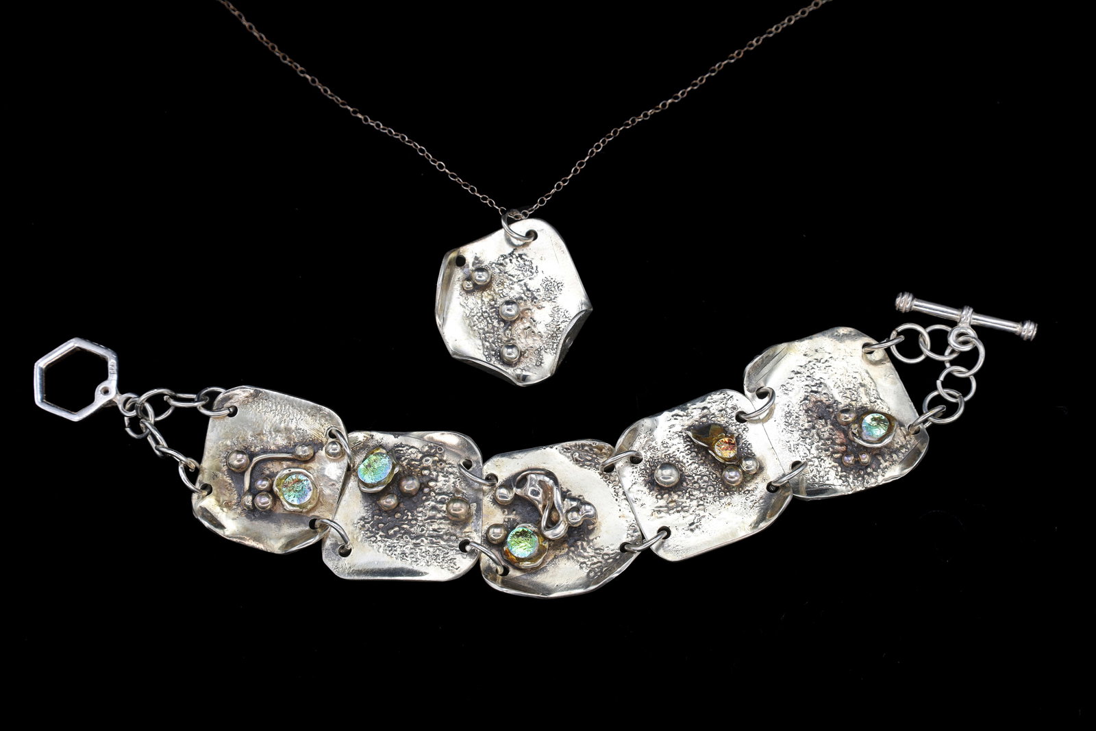 Brutalist Jewelry Set, 925 Sterling Silver And Foiled Glass Cabochons, Vintage Modernist Fashion: Measurements, Pendant: 1.6 inches Length, 1.1 inches Width, 0.25 inch Thick equivalent to 4.06 cm x 2.79 cm x 0.64 cm. Chain 19 inches length equivalent to 48.26 cm. Bracelet 7.5 inches Length x 1 inc