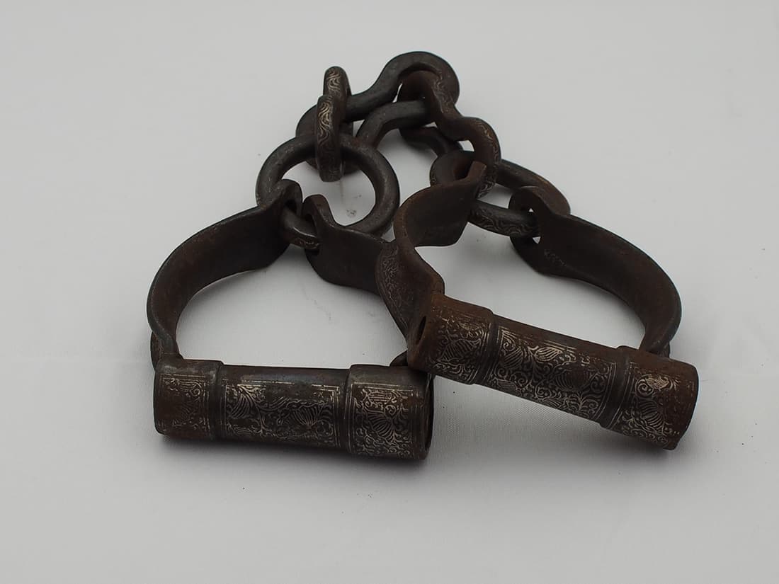Shackles silver inlaid. Possible Ottoman Empire Slave Anklets, but, nil provenance: Shackles silver inlaid. Possible Ottoman Empire Slave Anklets, but, nil provenance. Made from iron, inlaid with ornate silver designs, on the actual cuff and also the chain links. Requires a tool to o