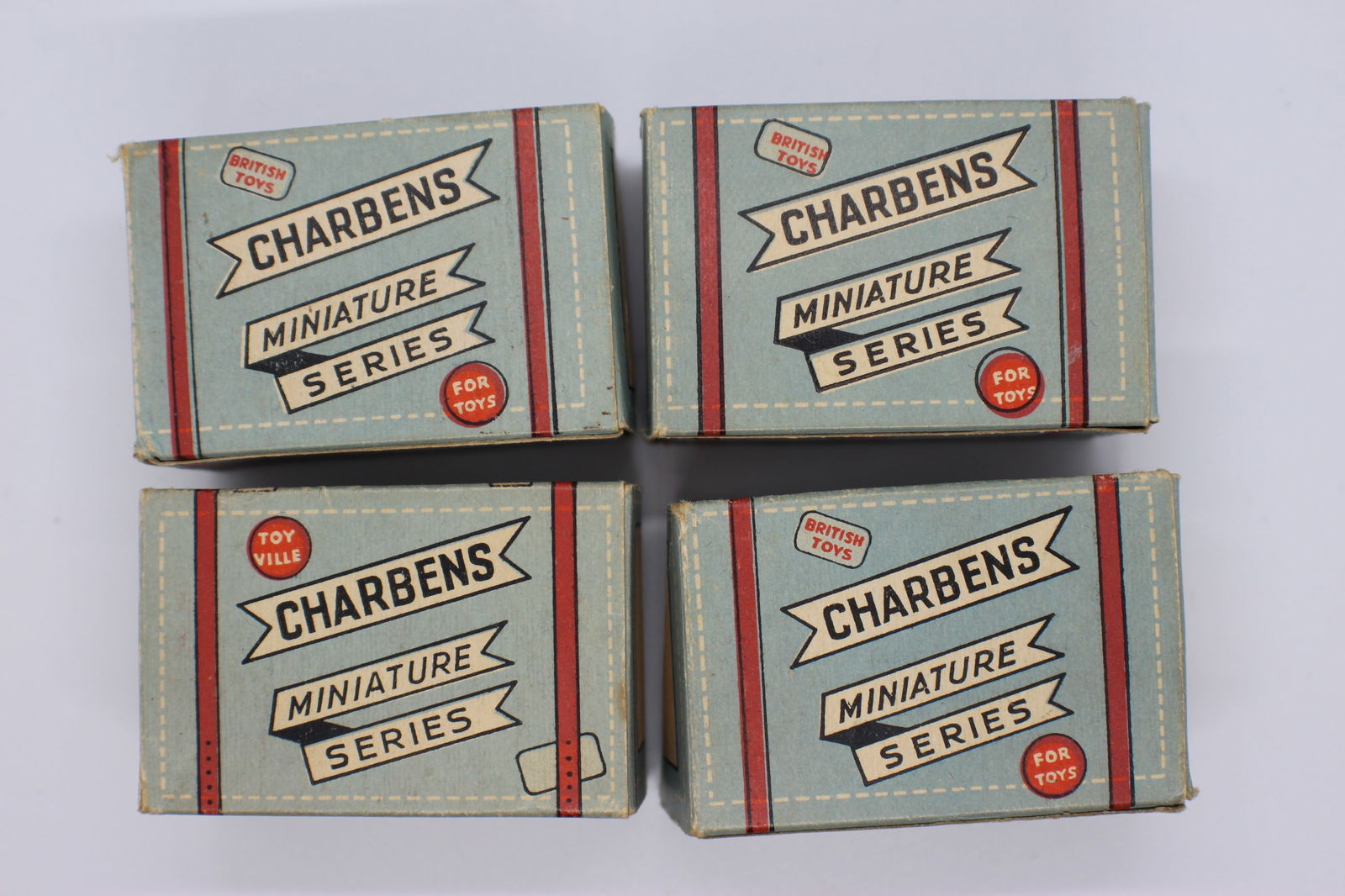 Mint set of four Charbens miniature tin toy cars in boxes of issue: 1950s Charbens range called 'Old Crocks', which included veteran cars, perhaps inspired by the popularity of the film 'Genevive'. The range included some unusual vehicles including a London bus and St