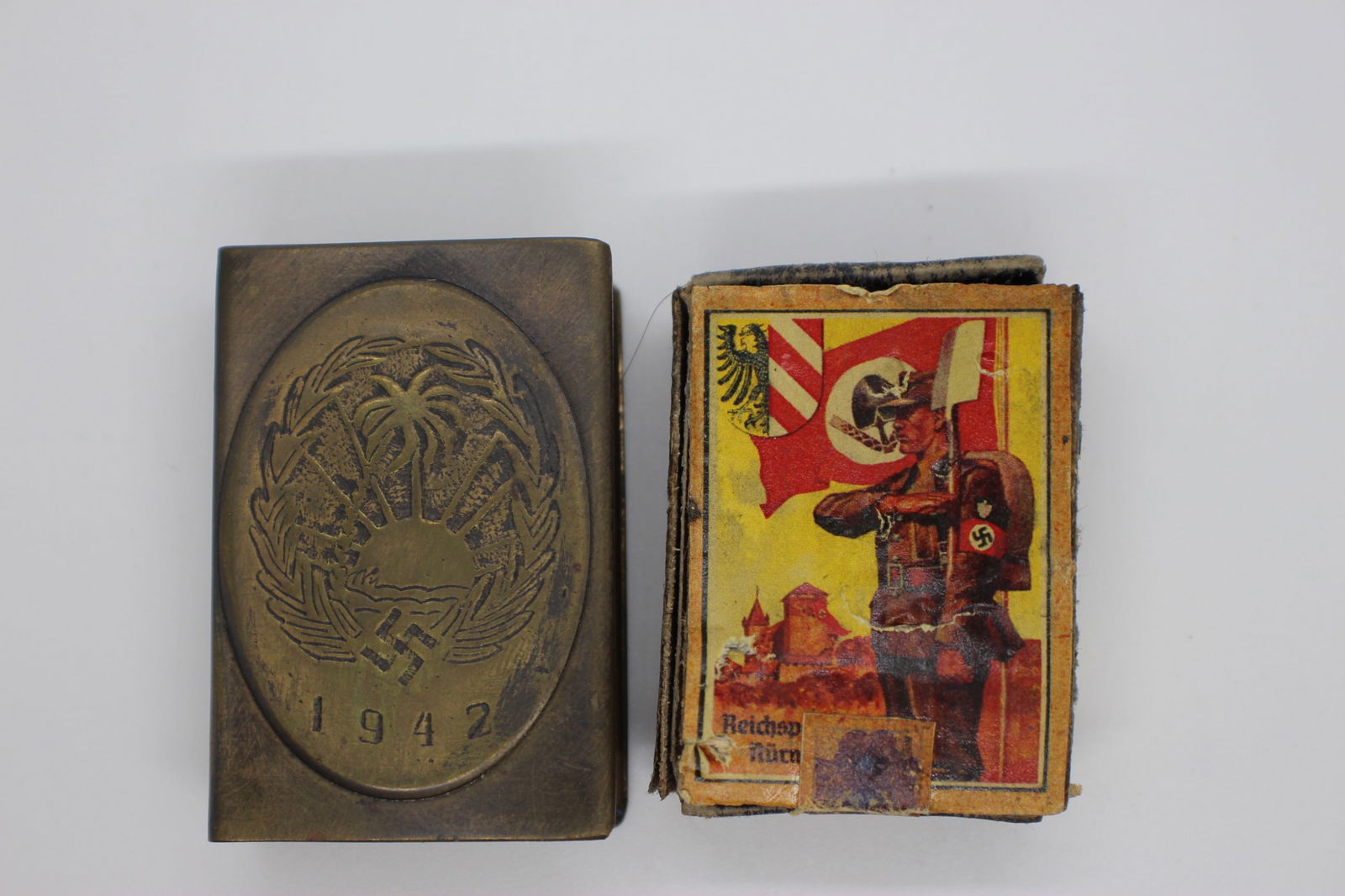 1942 brass match case with Hitler matches: Propaganda match case for Africa Corps dated 1942. Reverse is stamped Ges Gesch (Patent Pending). The matchbox inside has been added later and is a wood construction and broken. Still complete, howeve
