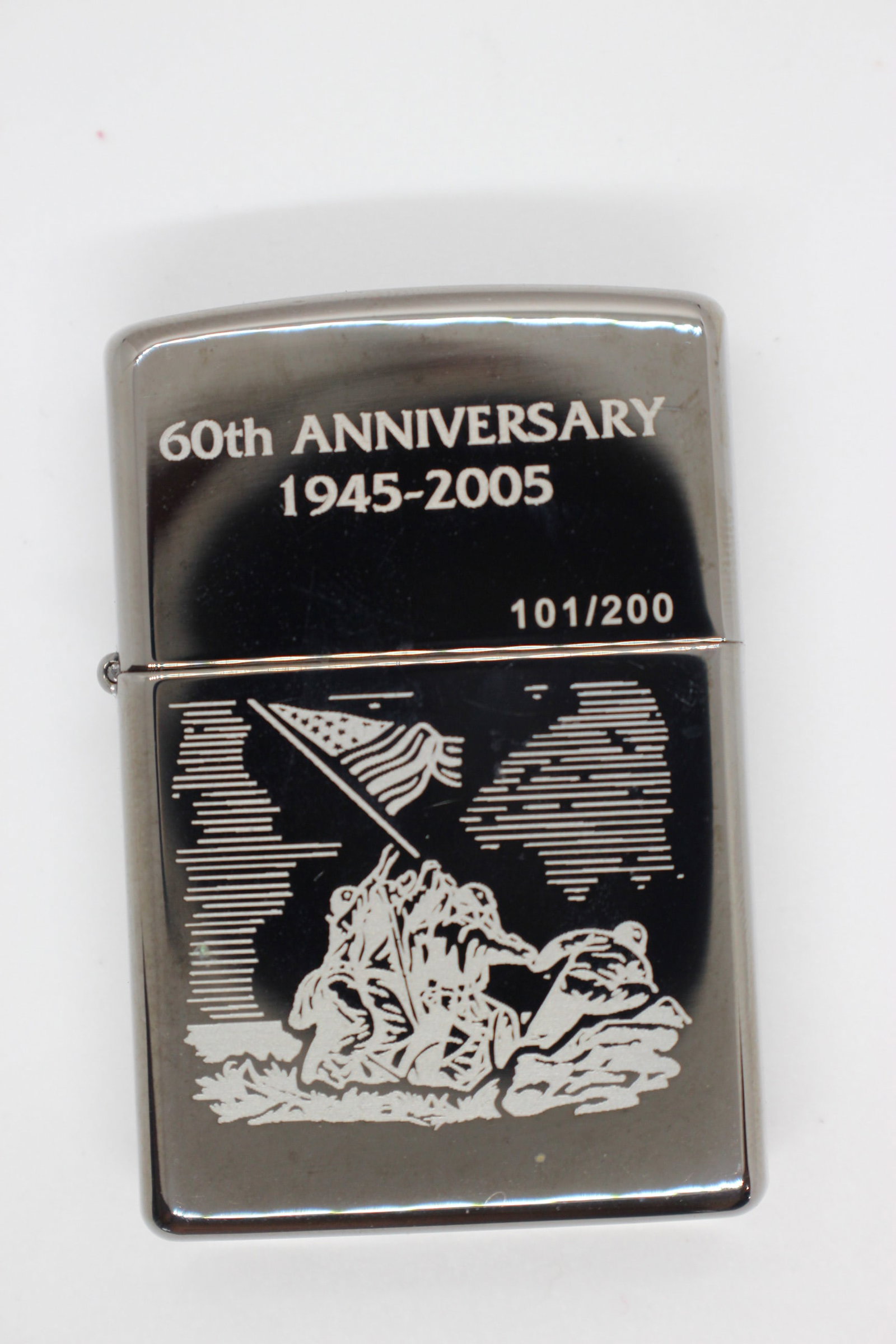Zippo lighter, 60th Aniv Ltd Edn Raising the Flag on Iwo Jima: Limited edition, no. 101 of 200.