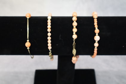 4- Coral and gold bracelets