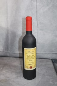 Bottle opener set in a wine bottle shape
