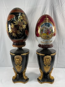 Pair of porcelain decorative eggs with stands