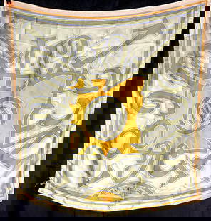 Franck Muller Silk Scarf: Description: A luxurious silk scarf by Franck Muller, known for its iconic timepiece designs. This scarf likely features a bold and intricate design inspired by the brand’s signature motifs, such as