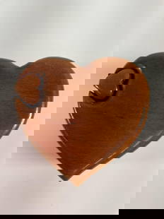 "Heart-Shaped Wooden Puzzle Box" Richard Rothbard: This charming heart-shaped wooden puzzle box is a delightful blend of artistry and functionality. With a smooth, polished finish, the box features a unique design with a removable piece that unlocks i