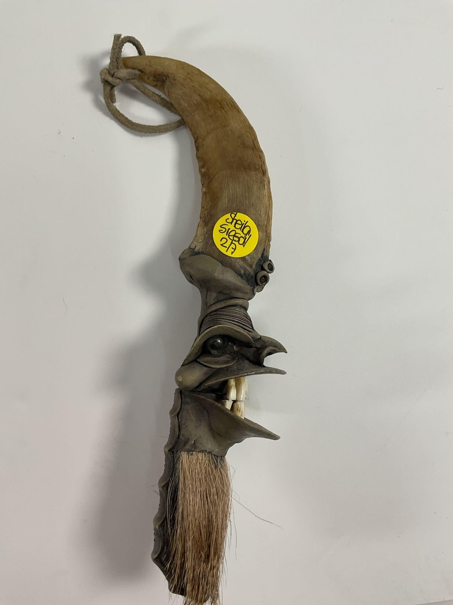 Brazilian TRAMONTINA Ritual Knife: This fascinating piece is a ceremonial object, potentially of tribal or ritualistic origin. It features a carved animal horn as the central element, adorned with intricately wrapped metalwork, includi