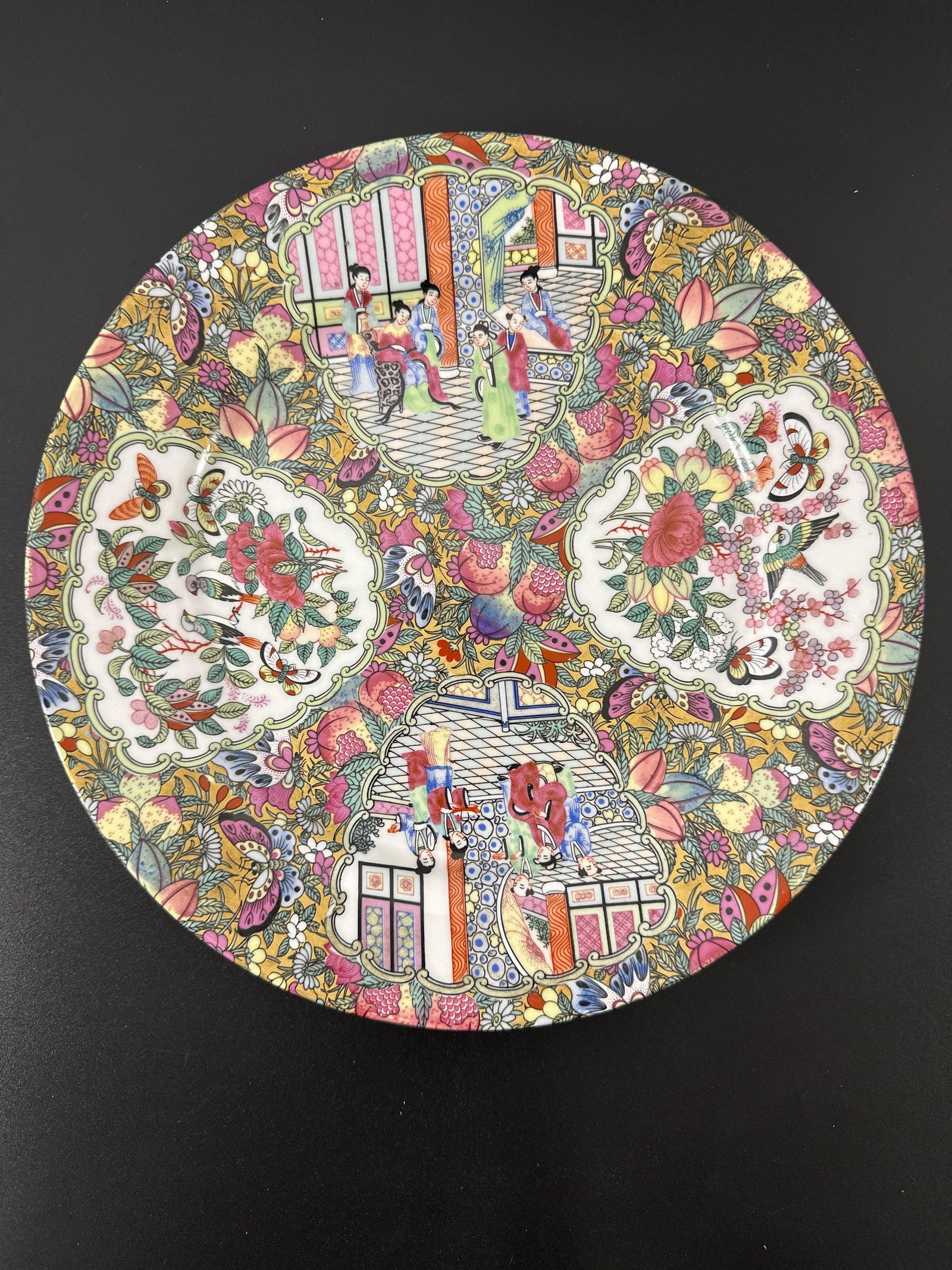 "Chinese Famille Rose Medallion Porcelain Plate" - Qianjiang: This is a vibrant and intricately decorated porcelain plate in the Famille Rose Medallion style, featuring traditional Chinese motifs, floral patterns, and detailed scenes with figures and architectur