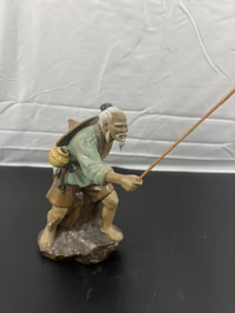 Porcelain Figurine of an Elderly Fisherman with Rod