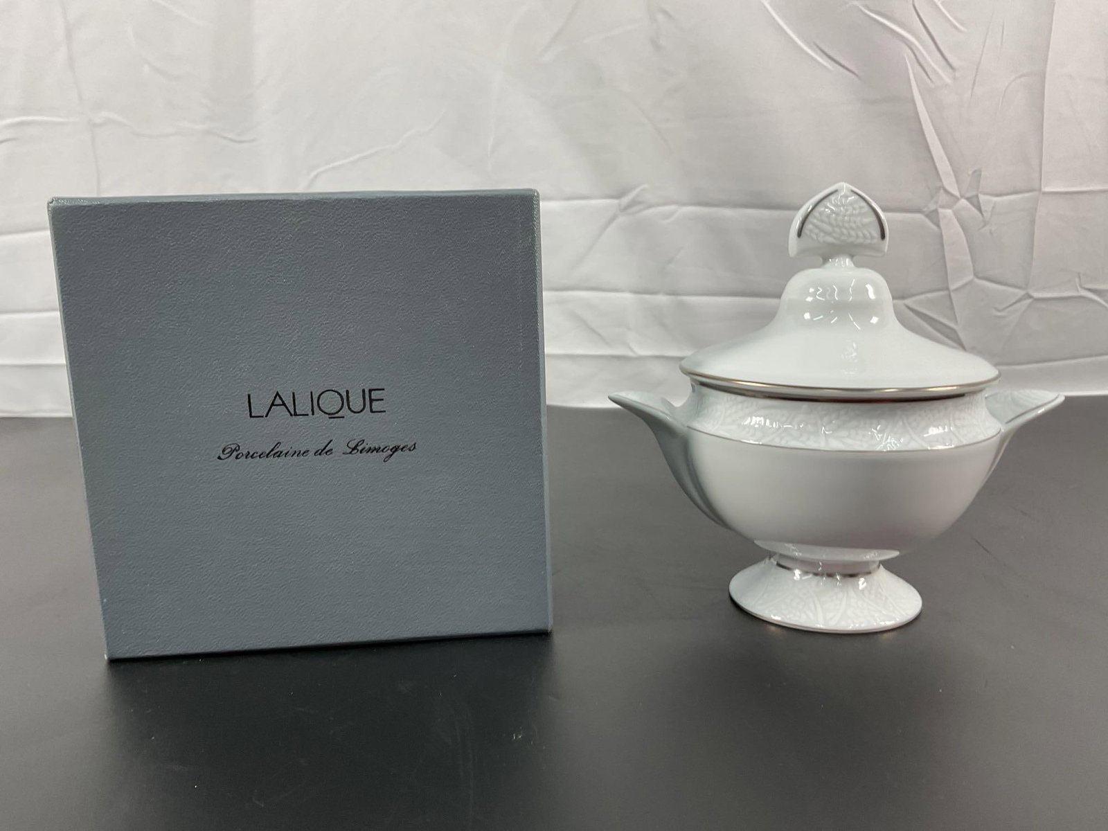 Lalique Limoges Porcelain Covered Sugar Bowl: This Lalique Limoges porcelain covered sugar bowl embodies timeless elegance and French sophistication. Beautifully crafted from high-quality Limoges porcelain, it features delicate embossed leaf moti