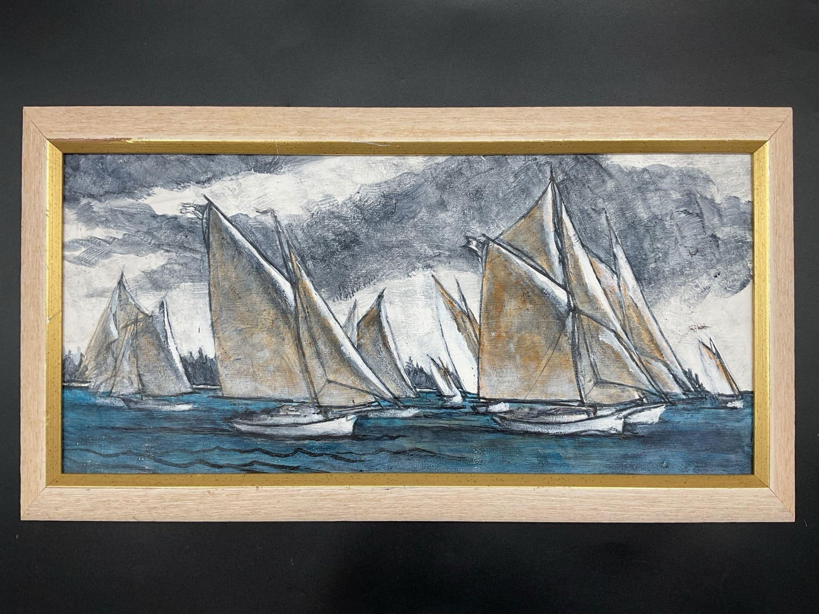 Vintage Sailboat Fleet Oil on Canvas: This framed painting depicts a fleet of sailboats racing under a stormy sky. The artist uses a dramatic contrast of dark, moody clouds and deep blue water, with sails highlighted in earthy tones. The