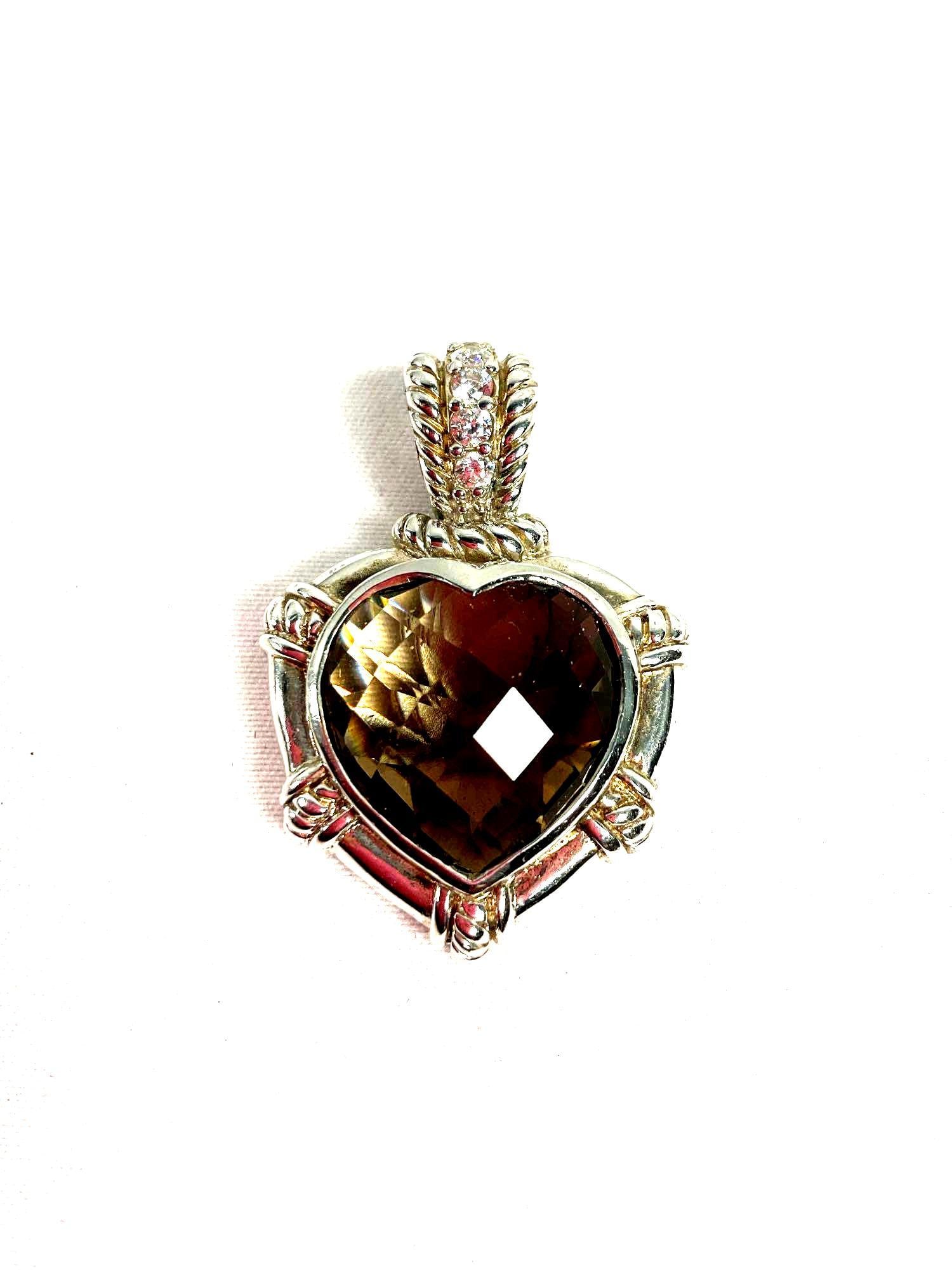 Judith Ripka Smoky Quartz and Diamond Heart Pendant: A stunning heart-shaped pendant featuring a faceted smoky quartz gemstone set in sterling silver with the brand's signature cable detailing. The bail is accented with pave-set diamonds, adding a touch