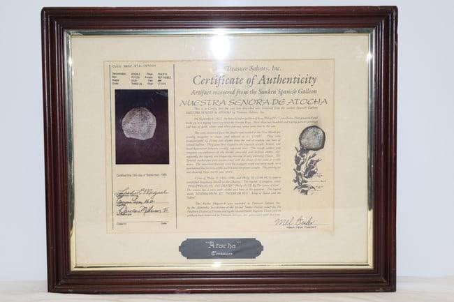1622 Atocha Fleet Wreck 8 Reale Silver Cob Coin: A framed 8 reale cob coin from the 1622 Atocha fleet wreck with certificate of authenticity. Dimensions: H:14in L:16in