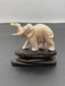 Hand-Carved Elephant Figurine on Wooden Base