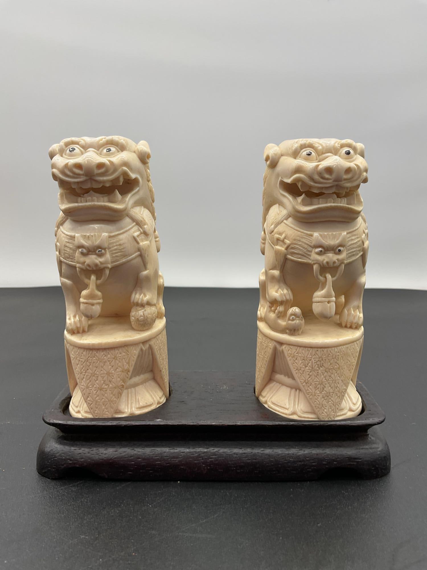 Pair of Carved Chinese Foo Dog Statues (1 of 4)