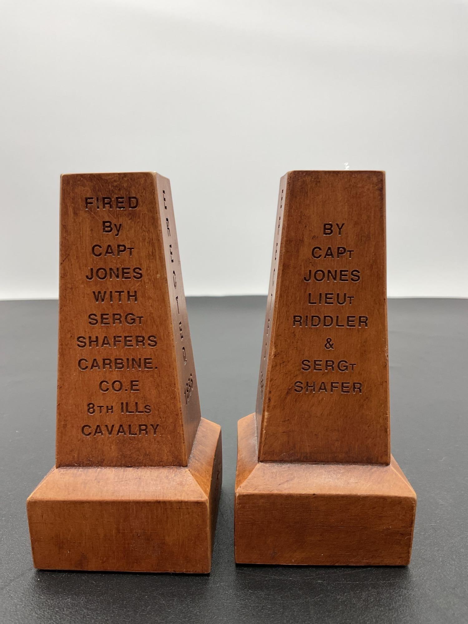 Pair of 1st Shot Gettysburg Souvenir Replicas: These are two wooden souvenir r1st Shot Gettysburg Souvenir Replicas, engraved with the words "ERECTED 1886" and signed "G. Castiel" on the base. These pieces likely commemorate the co