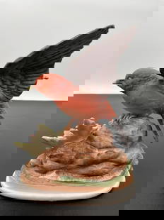 "Red Bird Figurine on Rock Base"- By Andrea: This charming figurine features a vibrant red bird with beautifully detailed feathers, poised on a rocky base with a touch of greenery. The bird's wings are partially open, capturing a moment of