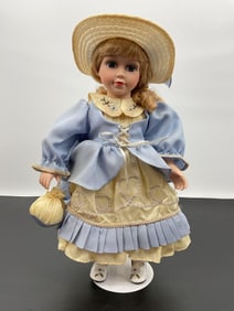 Porcelain Doll in Blue and Yellow Bonnet Dress
