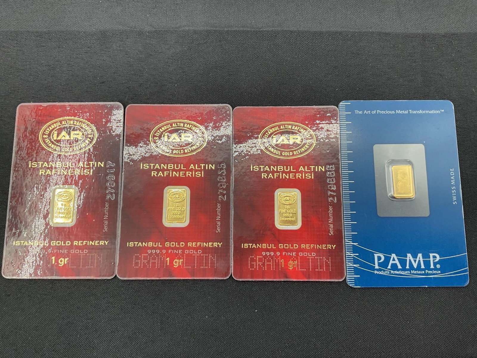 lot of 4 1gram gold bars: Description: 4 individual .999 1 gram gold bars factory sealed minted in Turkey and Switzerland.