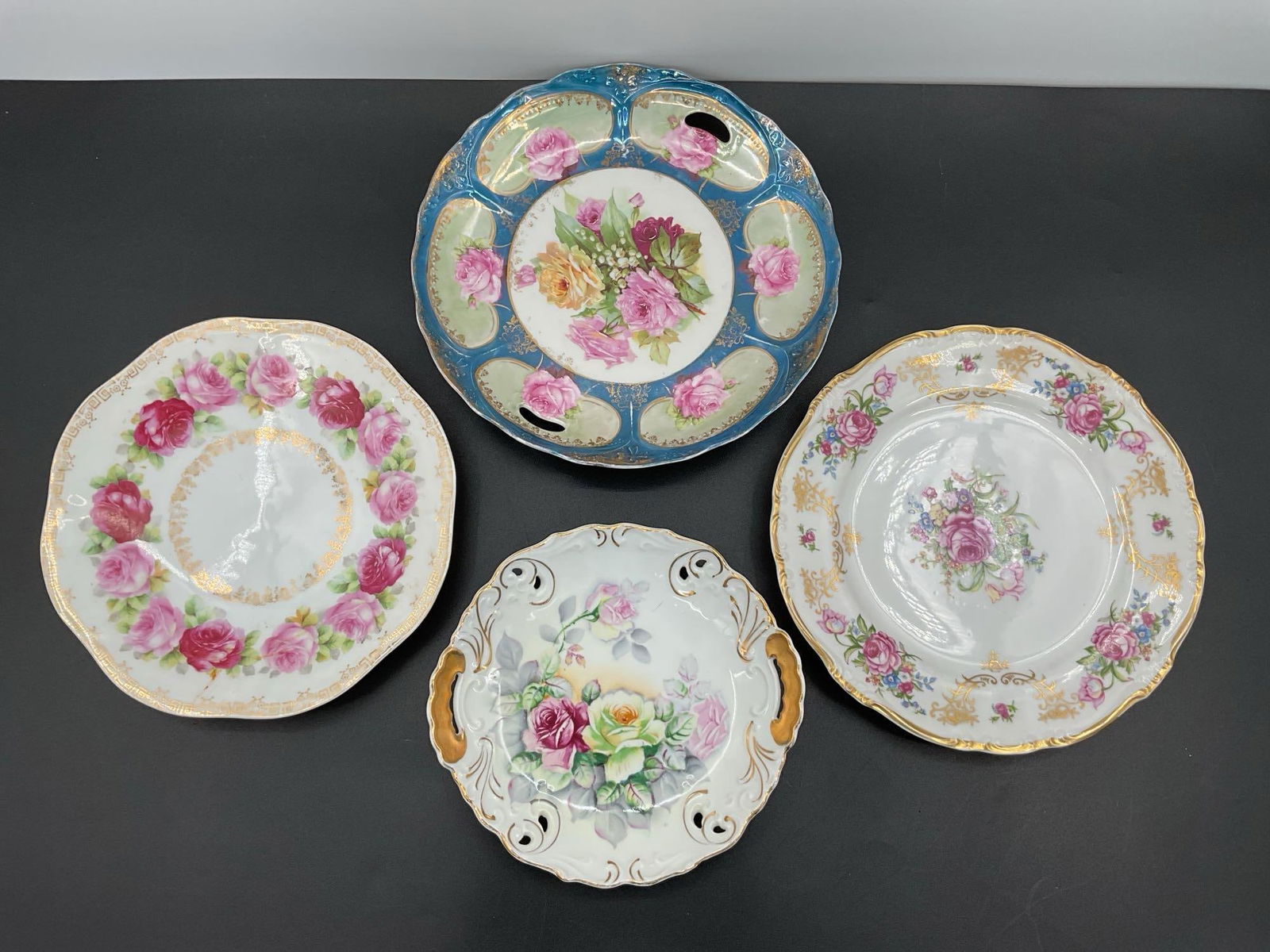 Stack of Decorative Floral and Gilt-Edged Porcelain Plates (1 of 3)
