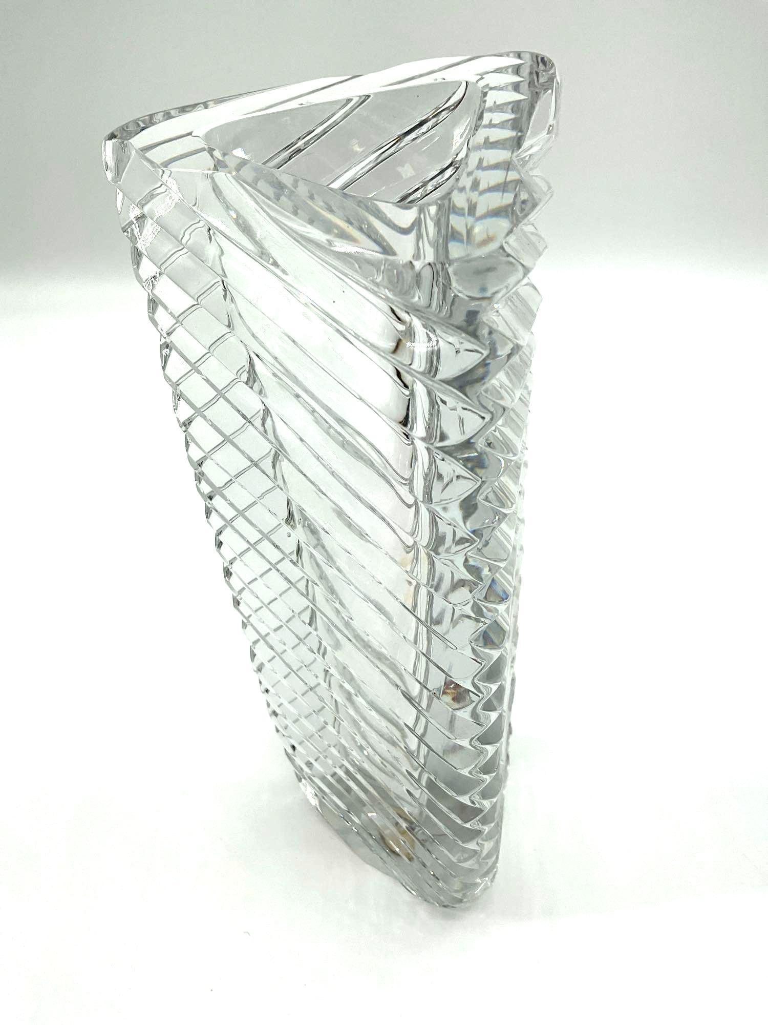 Rogaska Crystal Spiral-Cut Lead Crystal Vase: Tall contemporary vase by Rogaska Crystal, crafted from 24% lead crystal. Features a dynamic spiral cut pattern that wraps around the clear body, adding movement and light refraction. Signed at the ba