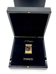 S.T. Dupont Pharaoh Limited Edition Lighter: Luxury limited edition lighter by S.T. Dupont Paris from the Pharaoh collection. Features Egyptian-inspired design with enamel detailing, hieroglyphic motifs, and a central falcon figure. Presented in