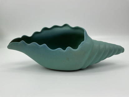 Van Briggle Art Pottery Conch Shell Vase: Sculptural conch shell vase by Van Briggle Pottery in Colorado Springs, finished in a soft turquoise matte glaze. The organic form mimics a real seashell with flowing ridges and a scalloped edge, refl