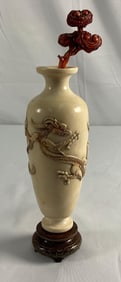 Carved Asian-style dragon vase with stand and coral branch