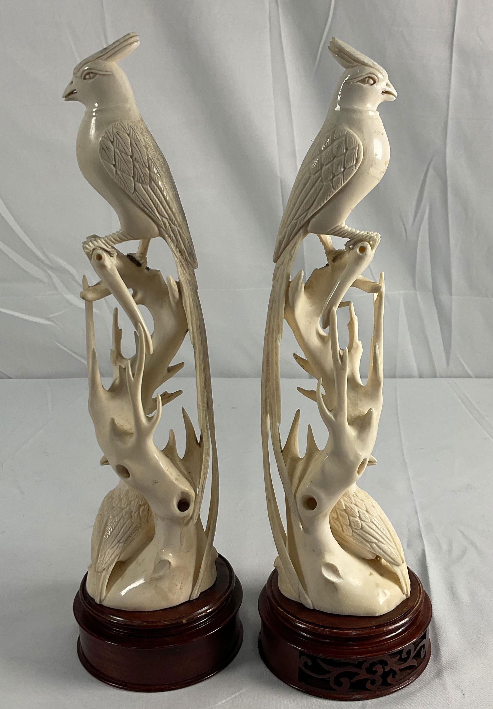 Pair of carved bird sculptures on wood bases (1 of 3)