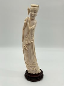 Asian Female Figure Holding a Flower