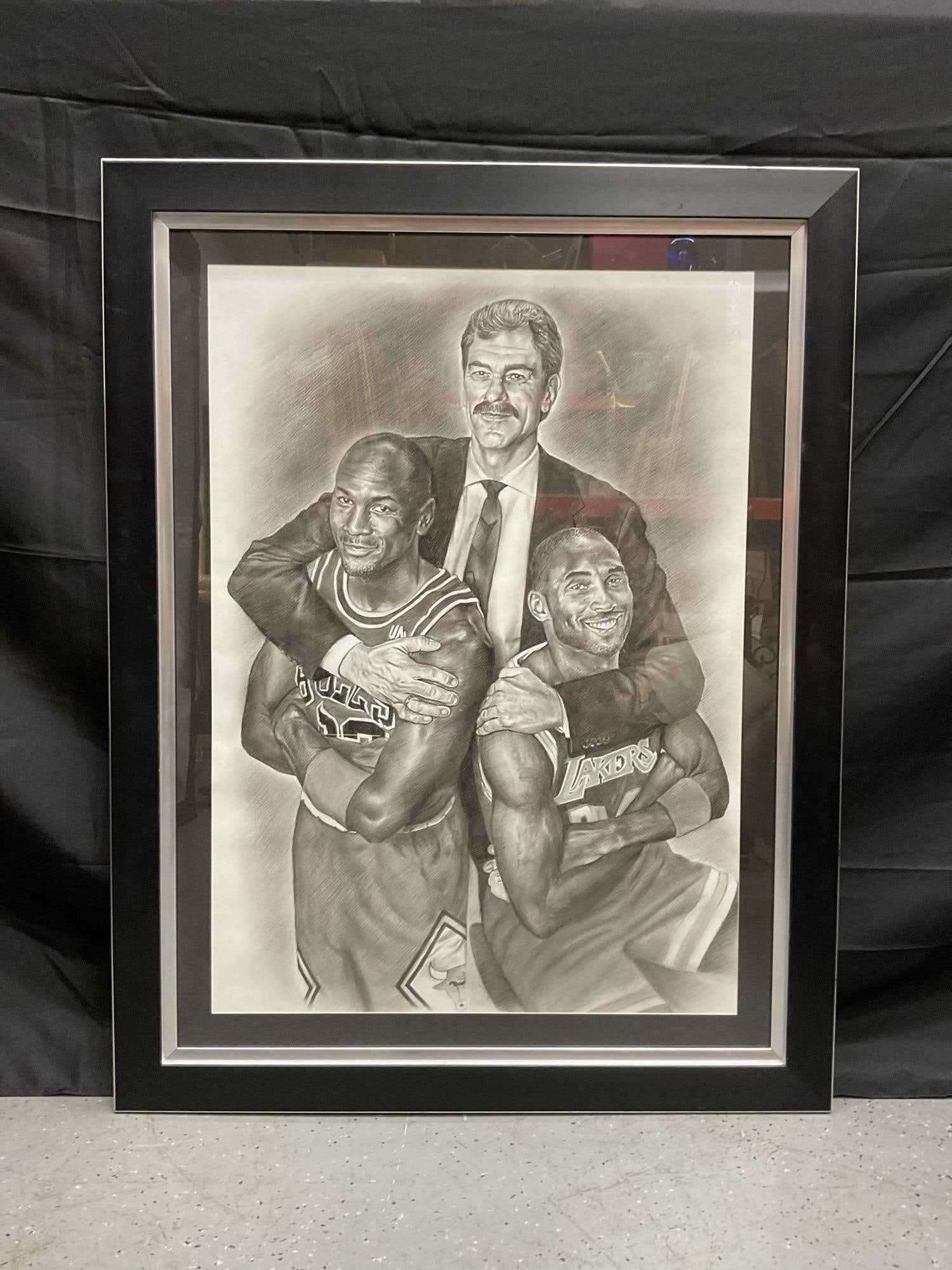 Phil Jackson with Michael Jordan and Kobe Bryant Portrait: Framed black and white artwork depicting legendary NBA coach Phil Jackson standing behind Michael Jordan and Kobe Bryant, with his arms around both players. The piece symbolizes Jackson’s role in le