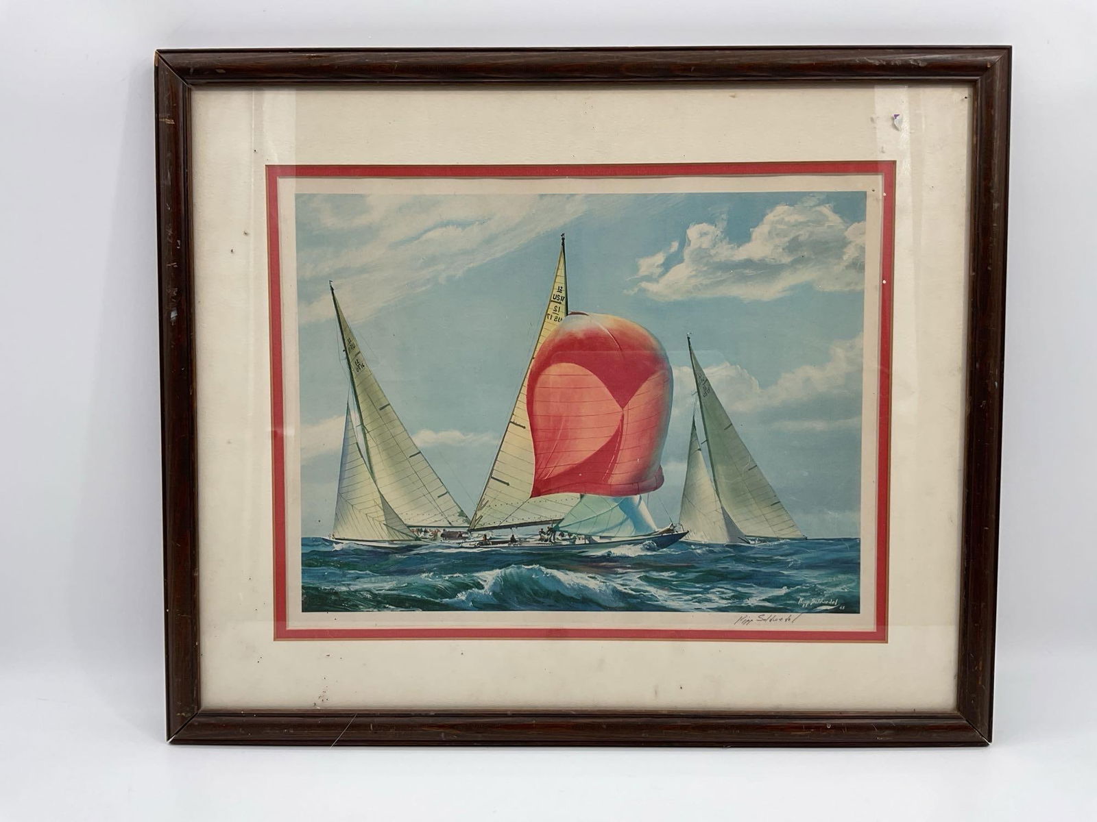 The Winning Run by Weatherly by Kipp Soldwedel: Nautical print depicting the yacht Weatherly with a vibrant red spinnaker sail leading a race across choppy seas. Artwork by noted marine artist Kipp Soldwedel, titled and signed in the print and hand